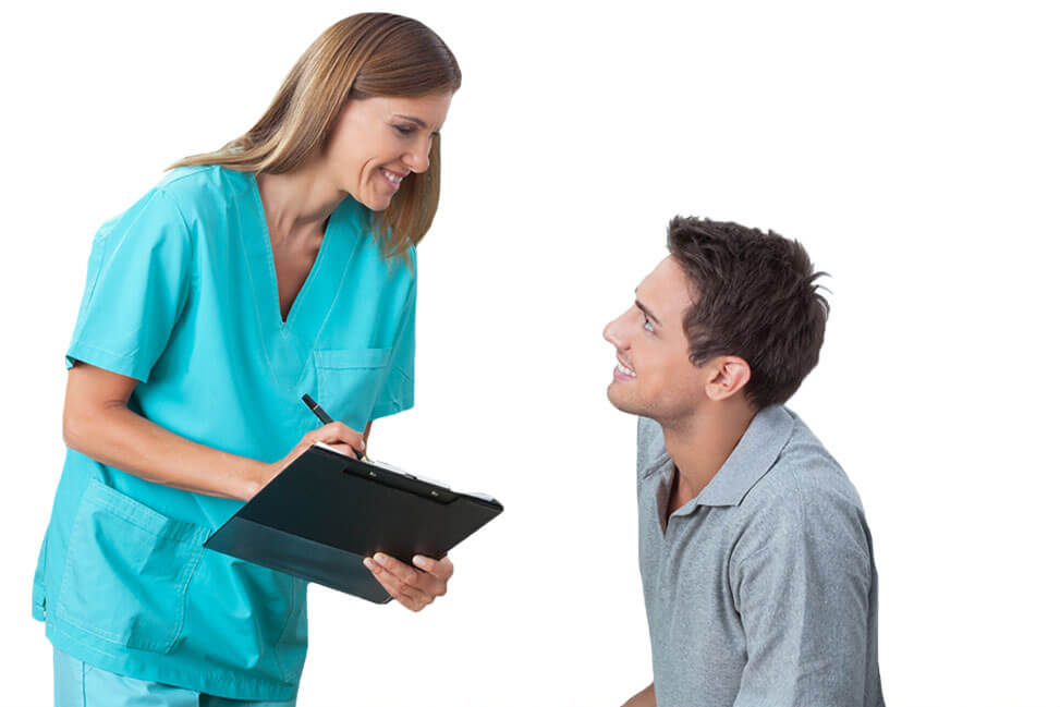 Female staff member talking to male patient
