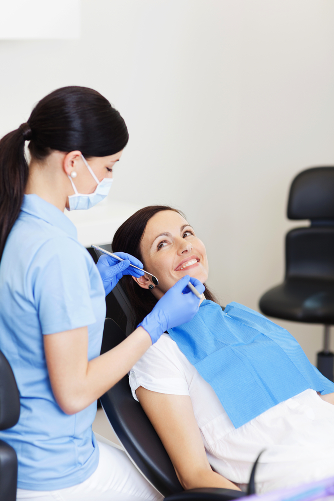 dentist examining patient's teeth