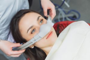 patient is fitted for nitrous oxide mask